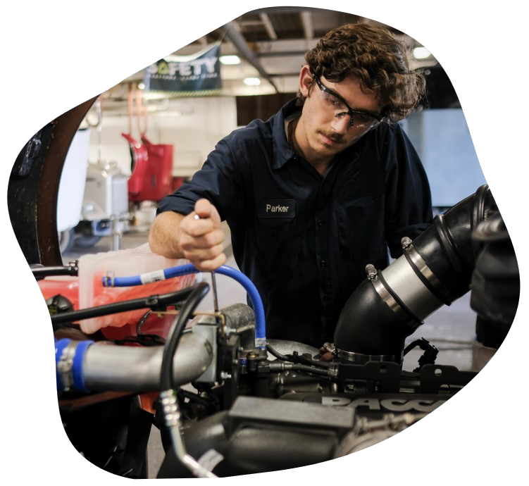 Picture of Dylan Parker working as an auto mechanic